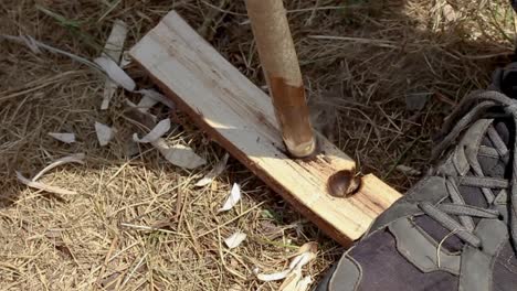 bushcrafter boy scout setting a fire using bow method