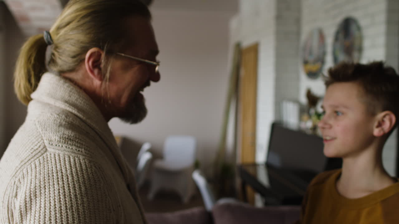 Caucasian man and boy at home