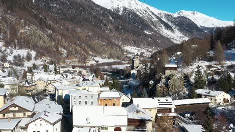 excellent aerial view of the wintry town of susch, switzerland