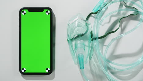 oxygen mask and smartphone with green screen