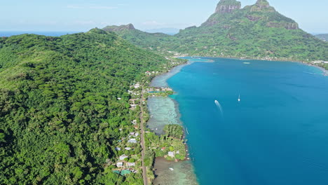 bora bora island, french polynesia. aerial view of scenic green coastline and blue lagoon