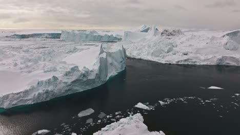 drone over sea and ice of ilulissat icefjord