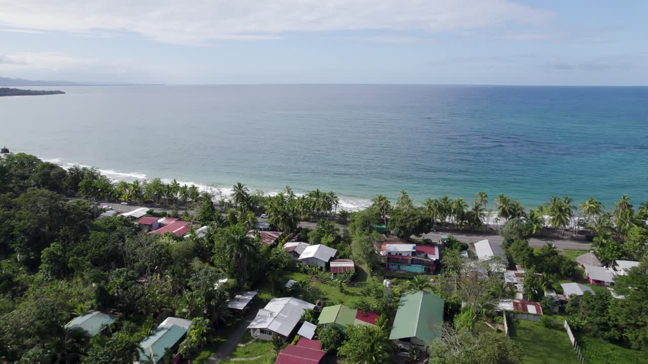 Coastal village with lush greenery and ocean in puerto viejo, Manzanillo, costa rica, aerial view