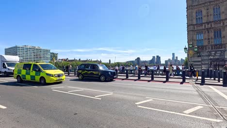 ambulance navigating traffic by westminster palace