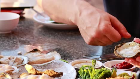 eating oysters at a restaurant