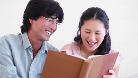 Man-and-a-woman-reading-a-book-together