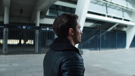 Portrait-of-young-man-walking-street.-Focused-man-walking-on-empty-city