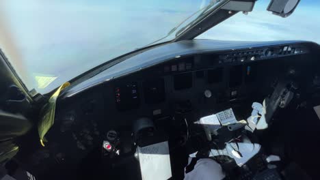 inside view of a jet cockpit from the captain seat in a real flight at cruise level fl360