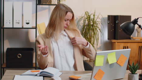 tired sad exhausted businesswoman working on laptop at office with many sticker tasks, panic attack