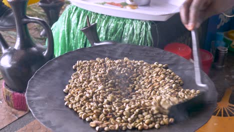 bunna shop, or coffee shops in ethiopia very simple and using traditional ways, this shot when start roasting the beans to prepare the drinks