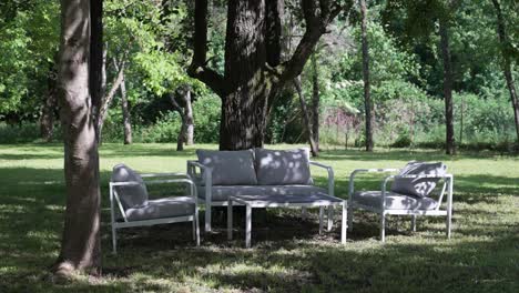outdoor garden furniture in a shaded area under trees