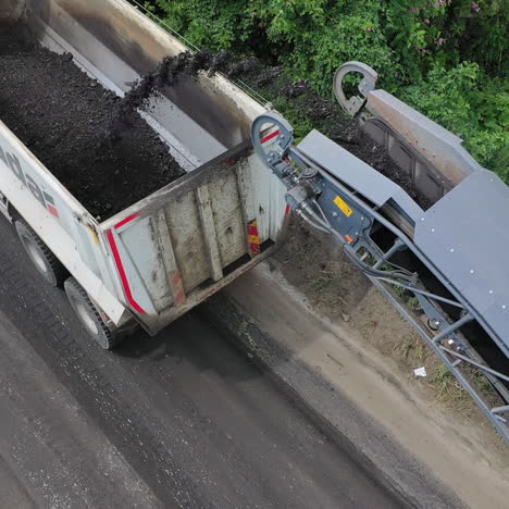 roadwork on asphalt replacement. special equipment for laying new asphalt on the road in the countryside. aerial view.