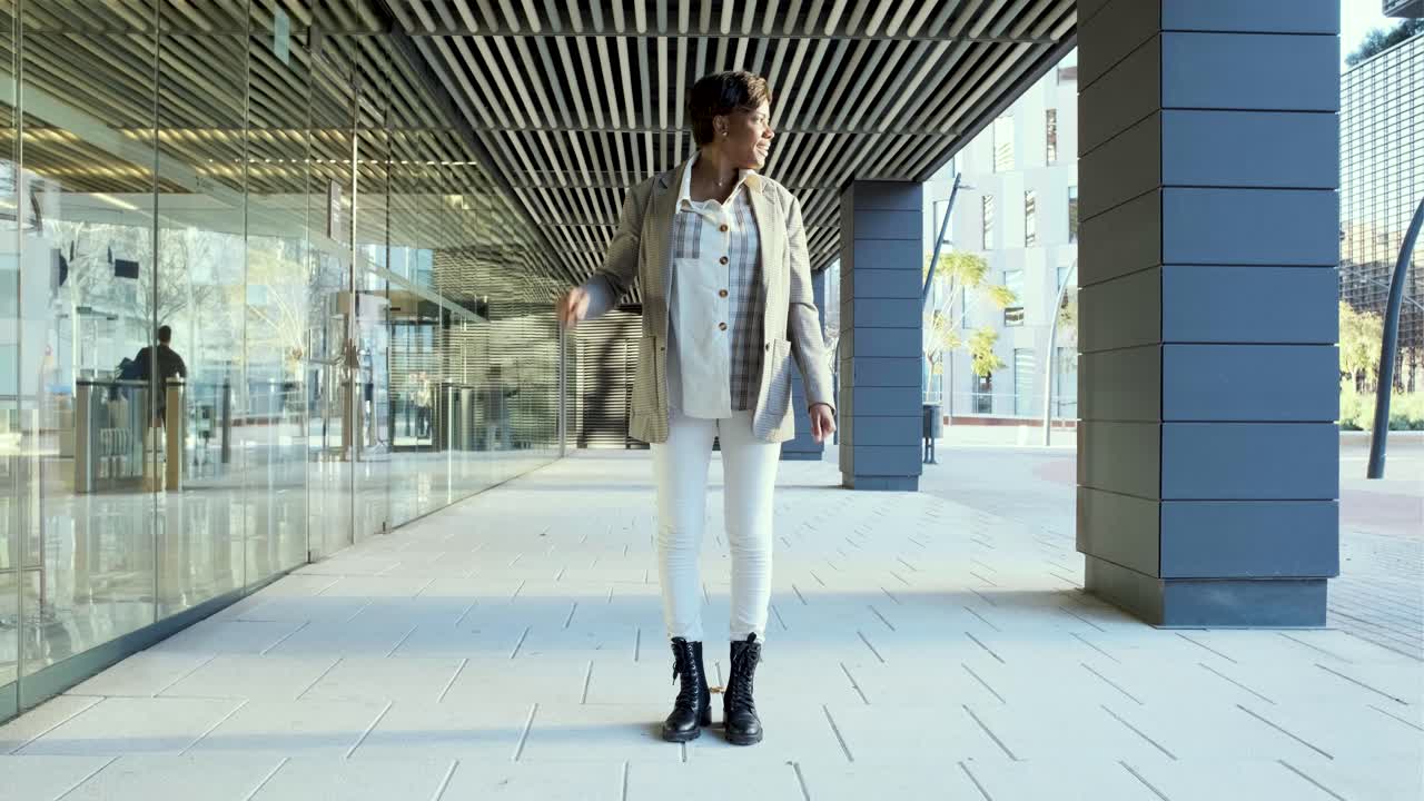 Woman Dancing Happily in an Urban Setting