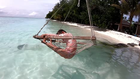 Down-Syndrome-Child-Enjoying-the-Swing-on-The-Beach