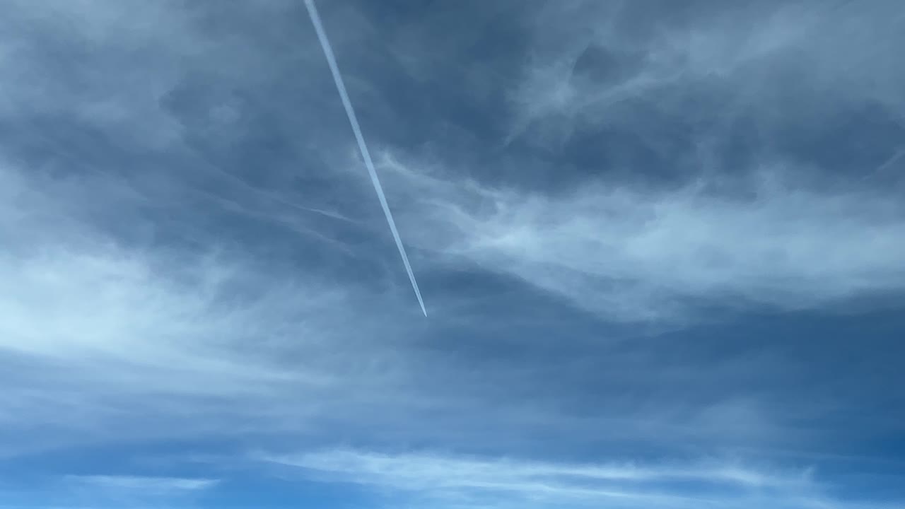 A pilot&rsquo;s point of view of a jet wake flying ahead and 4 levels higher, with some frayed clouds