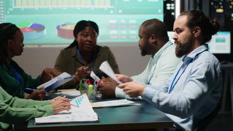 multiethnic group of advisors reviewing data insights and financial situation