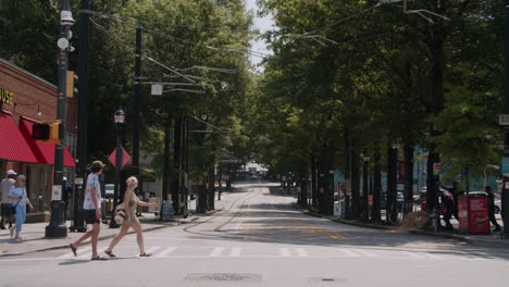 city street scene with people crossing