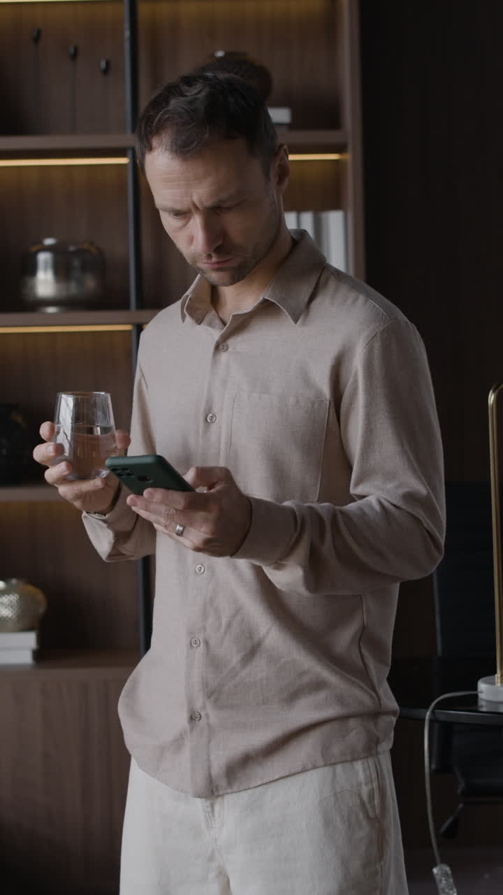 Man using smartphone indoors