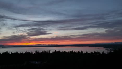 drone shot of a warm red sunset over the western washington university campus