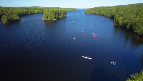 drone timelapse of a group of people kayaking on a river in the sun during summer