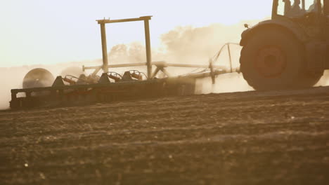 tractor plows through the soil 7