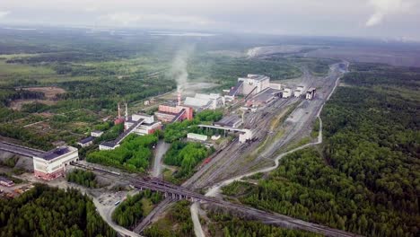 aerial view of an industrial complex in a forested area