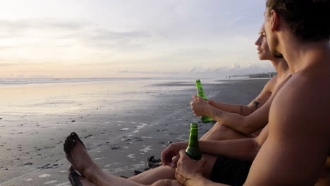 Young-couple-sitting-on-the-sand