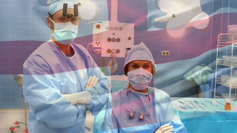 animation of flag of england waving over surgeons in operating theatre