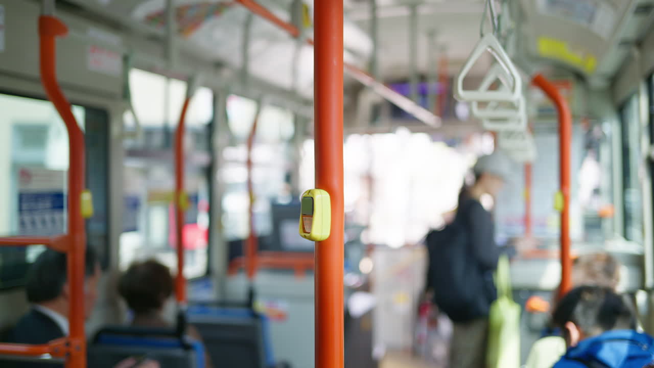 Blurred view of people inside a bus in the Gion area in Kyoto, Japan in daylight