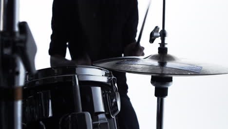 close up of drummer playing drum kit in studio shot on r3d