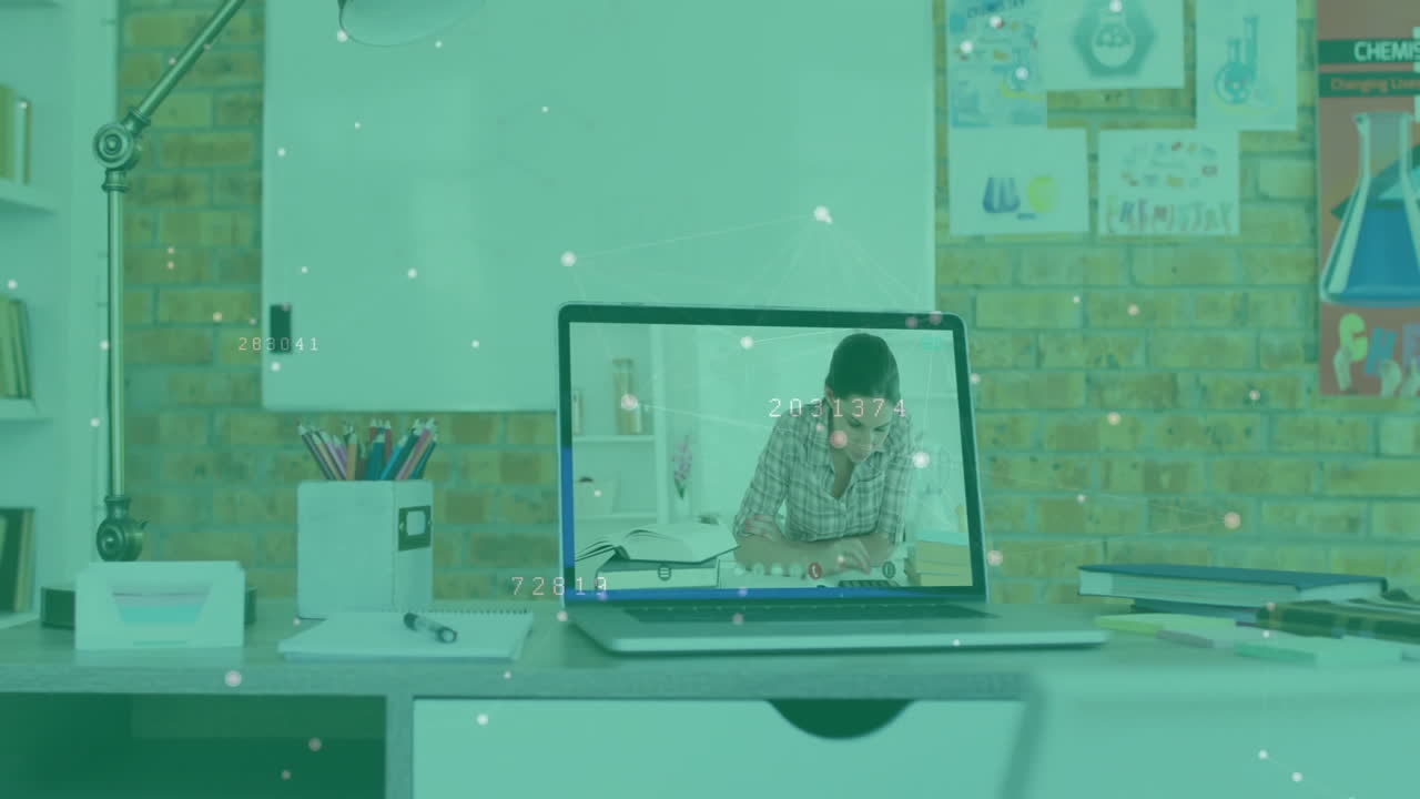 Student studying at modern home office desk with colored pencils, using animated education charts