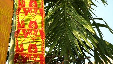 swinging prayer flag during sunset in chiang mai, thailand