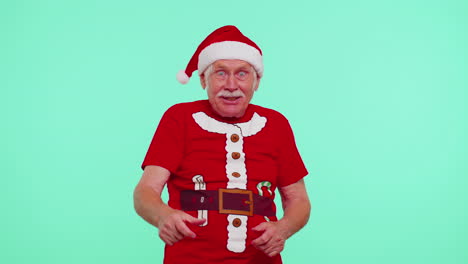 Senior-Christmas-grandfather-man-smiling-excitedly,-pointing-to-camera,-beauty-choosing-lucky-winner