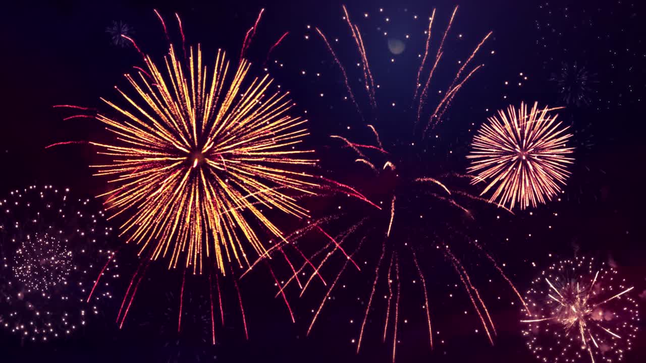 una explosión de fuegos artificiales brillantes con luces bokeh en el cielo nocturno.