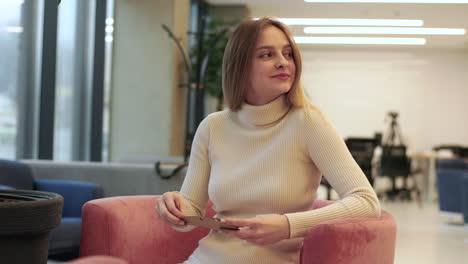 Woman-sitting-in-the-office