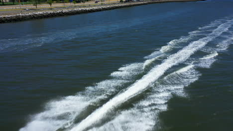 An-aerial-view-of-a-couple-riding-on-a-red-jet-ski