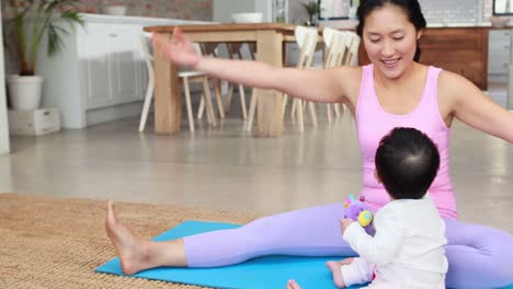 mother and baby doing yoga