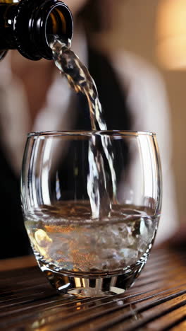 pouring wine into a glass