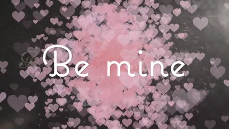 Be-mine-text-banner-against-multiple-pink-heart-icons-floating-against-black-background