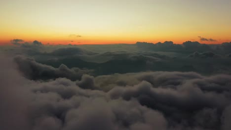 flight above massive clouds with horizon in background on high altitude