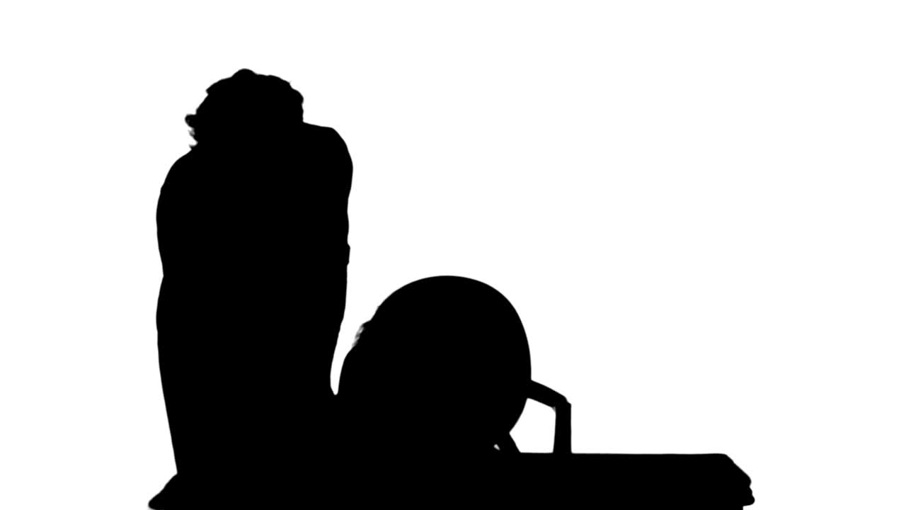 Silhouette Mom helping daughter with homework track matte