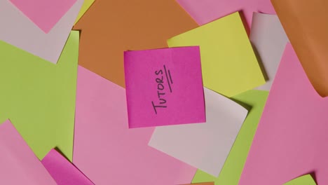 Education-Concept-Of-Revolving-Sticky-Notes-With-Tutors-Written-On-Top-Note