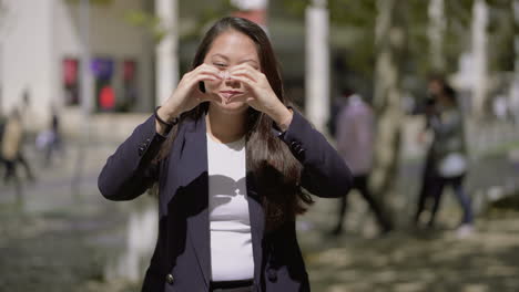 happy young woman smiling at camera outdoor