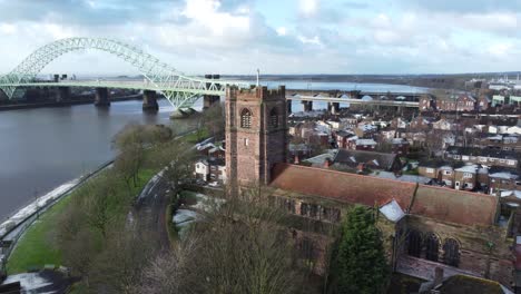 aerial view industrial jubilee bridge small town frosty church rooftops neighbourhood north west england left orbit