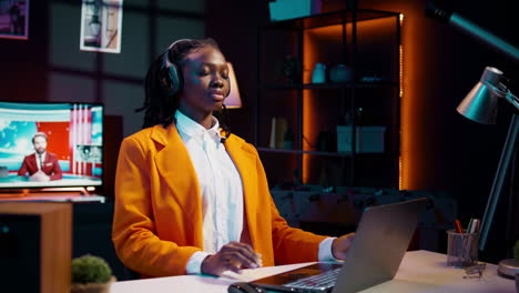 African american girl enjoying relaxing podcast or music on headset