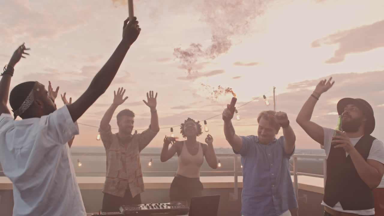 Friends with Color Smoke Bombs Partying on Rooftop