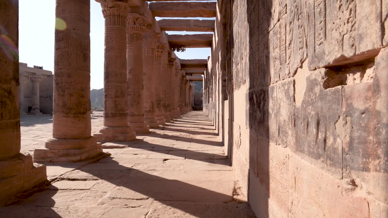 The columns of the ancient temple Philae with hieroglyphs in Aswan, Egypt.