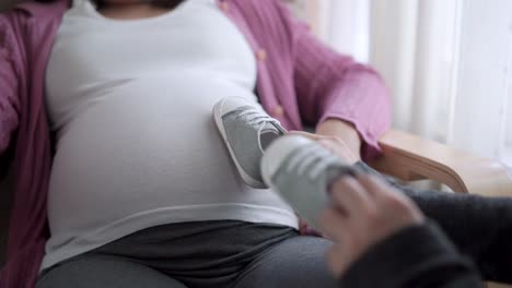 pregnant couple feels love and relax at home.