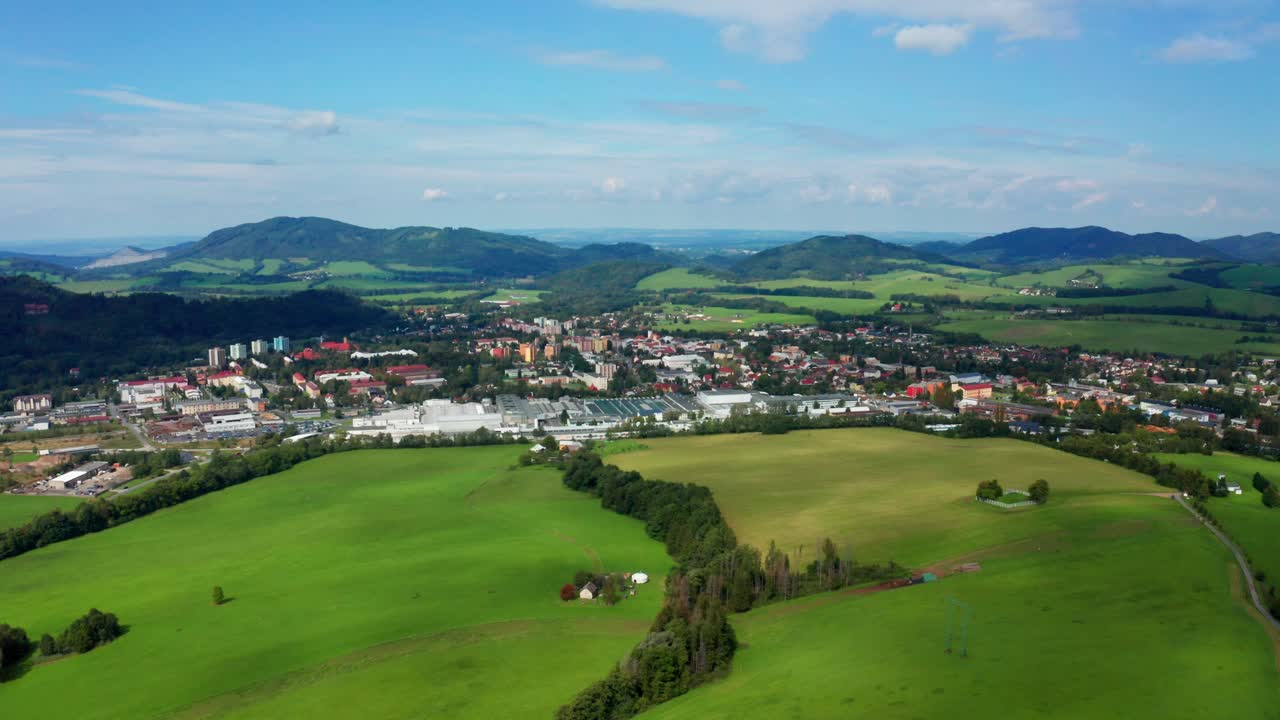 Reveal drone shot czech small city with beskydy mountains