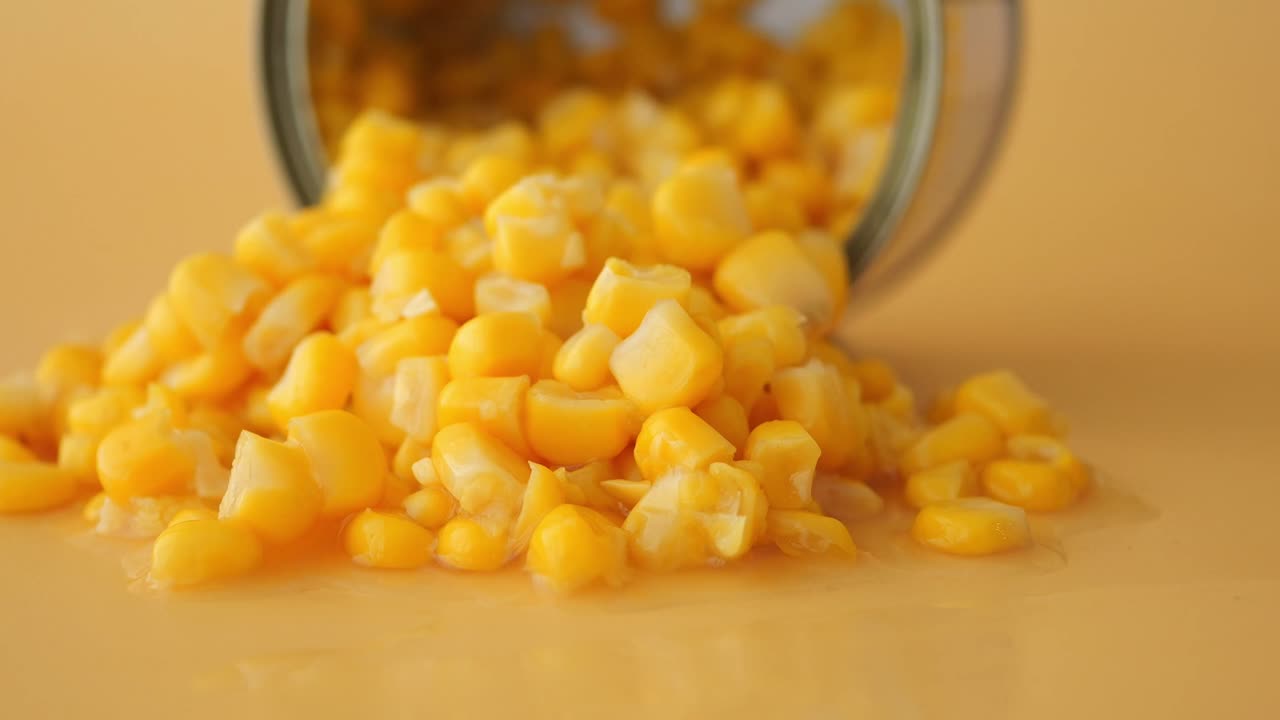 Canned corn spilling onto surface